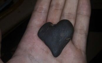 a heart-shaped stone as a talisman of good luck